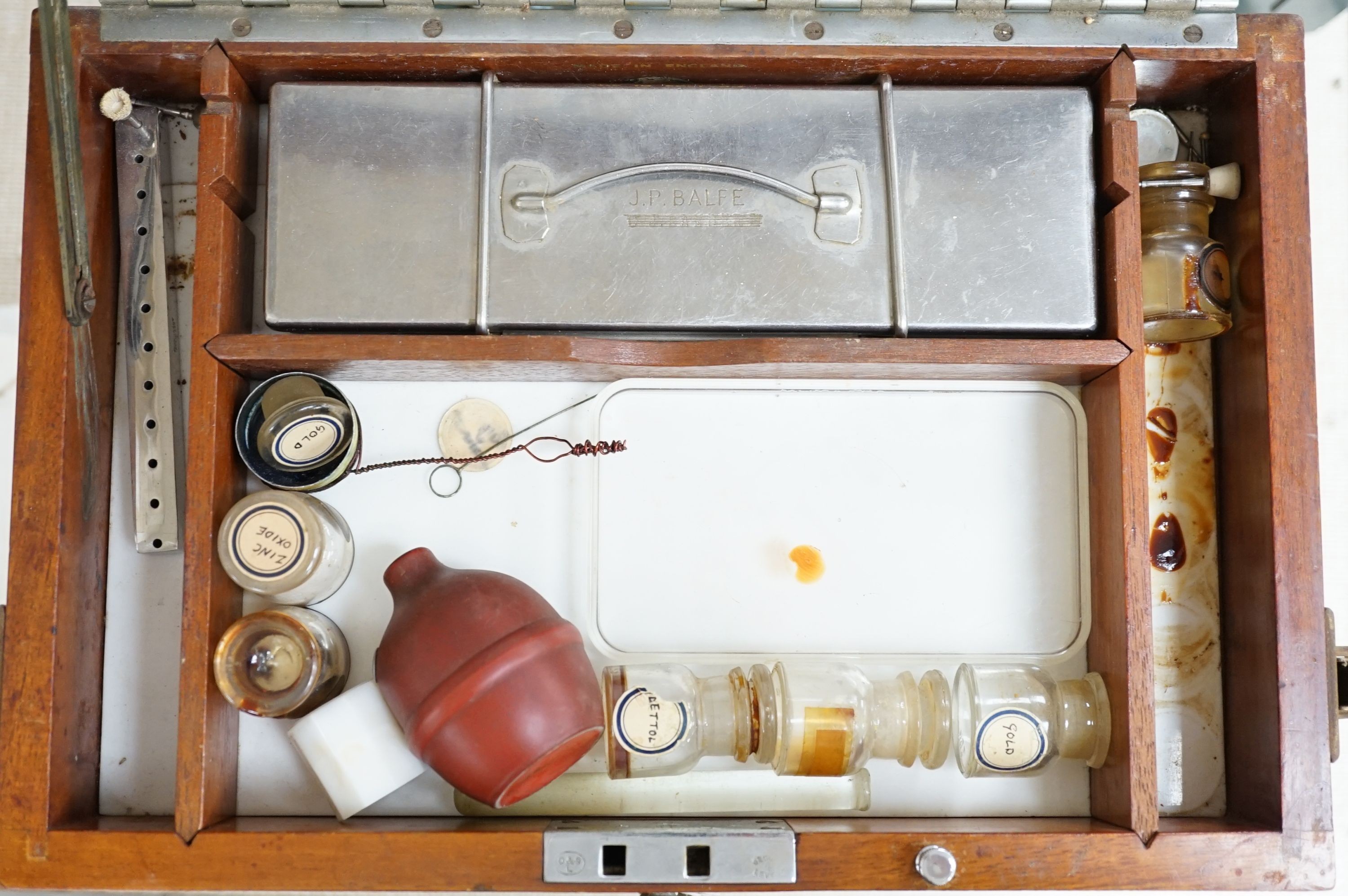 A mid 20th century mahogany dentist’s cabinets and accessories, 39.5 x 34 cms wide.